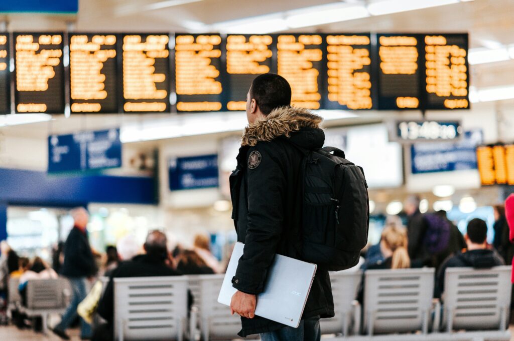 Travel Security Tundra International Airport with Man staring at the departure boards